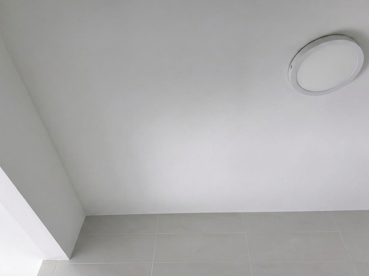 The same HDB ceiling clean, dry and repainted — after waterproofing repair