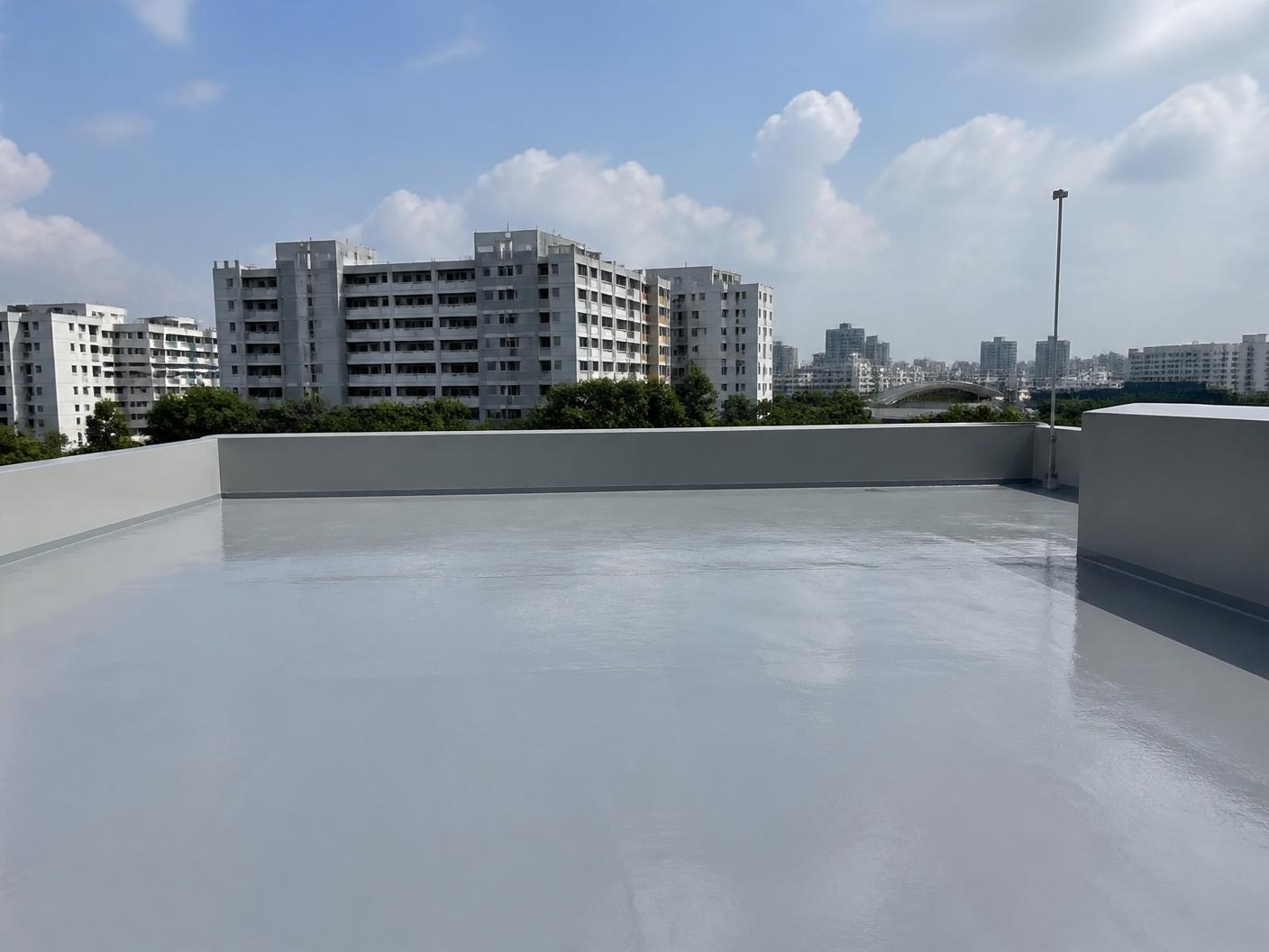 Singapore HDB rooftop terrace freshly finished with a light-grey waterproof coating